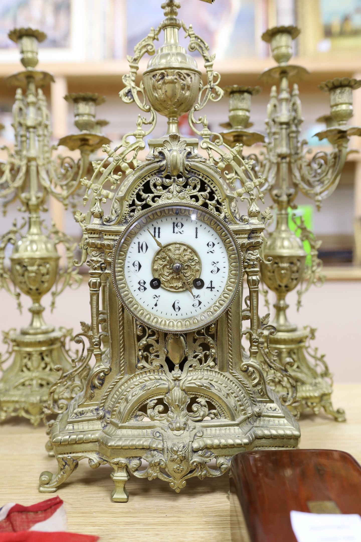 A French brass clock garniture c.1900, Japy Freres movement. 48cm high